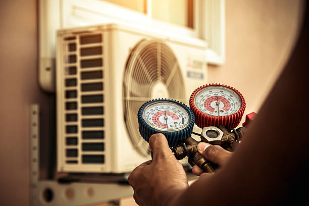 Professional Heat Pump Repair technician working in Elfers, FL
